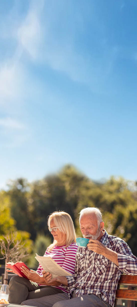 A man and woman sit on a bench, reading books. AI generated content